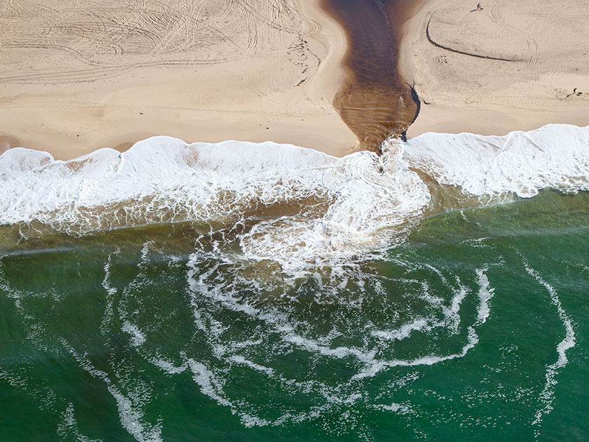 Sewage draining into ocean coast
