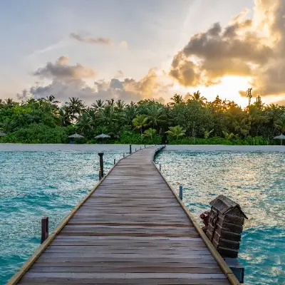 Maldives dock and coastal sunset