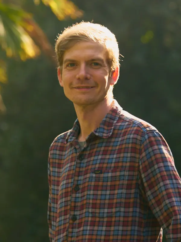 David Blake outdoors among trees