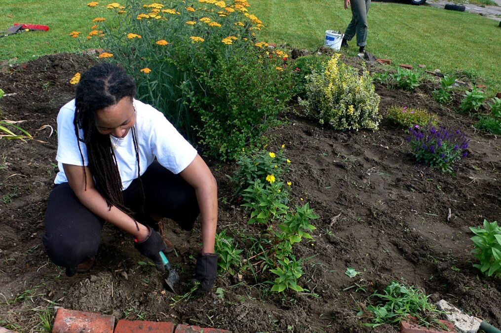 Alesia Montgomery gardening in Detroit.