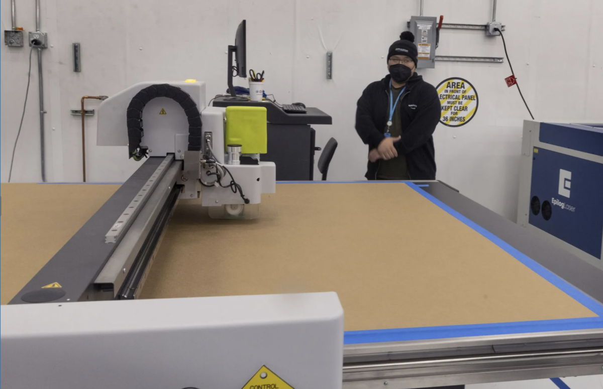 Amazon warehouse worker and box