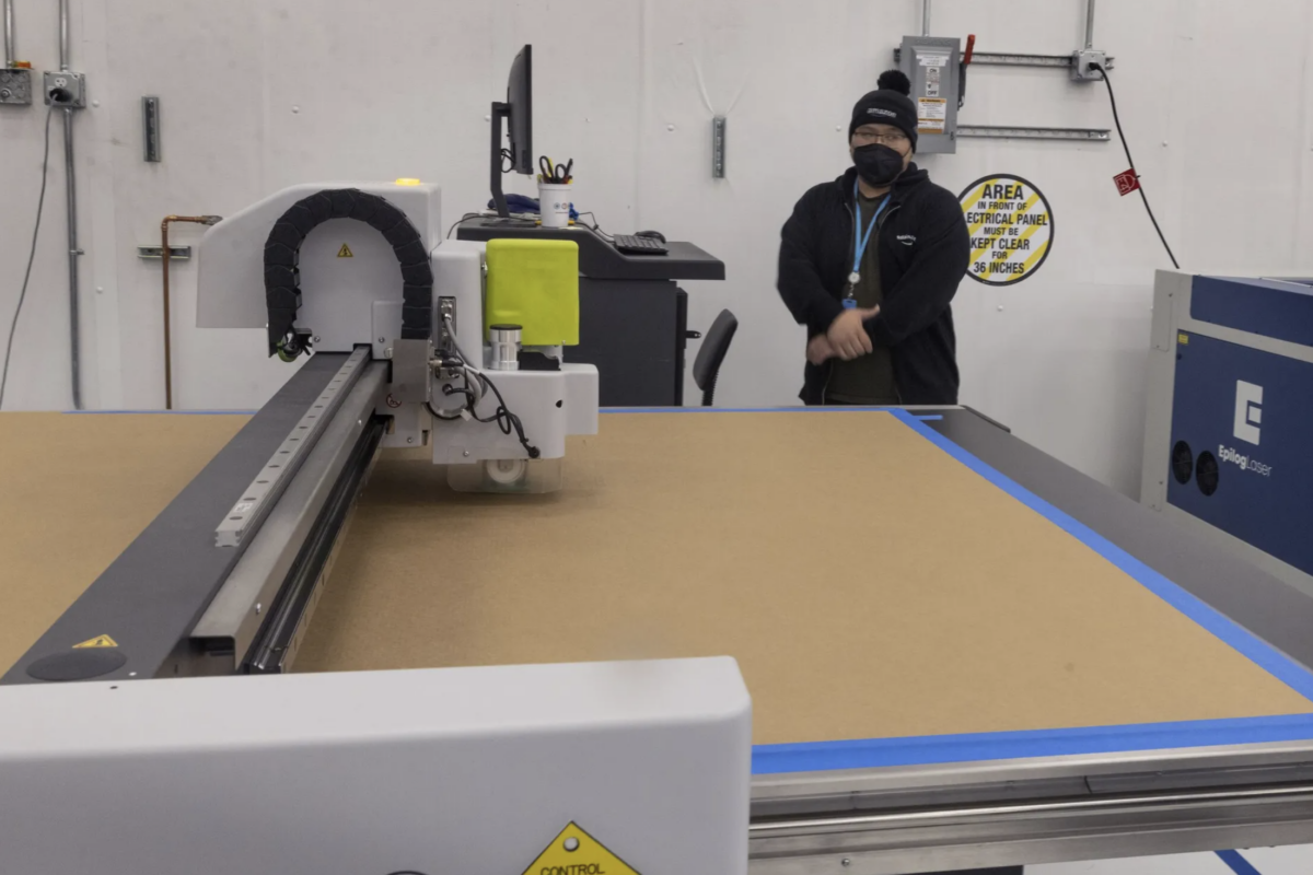 Amazon warehouse worker and box