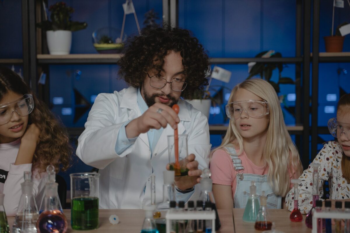 Science teacher in lab with students Tima Miroshnichenko Pexels