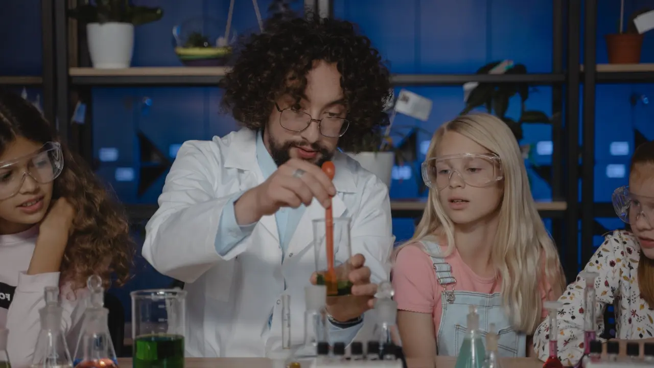Science teacher in lab with students Tima Miroshnichenko Pexels