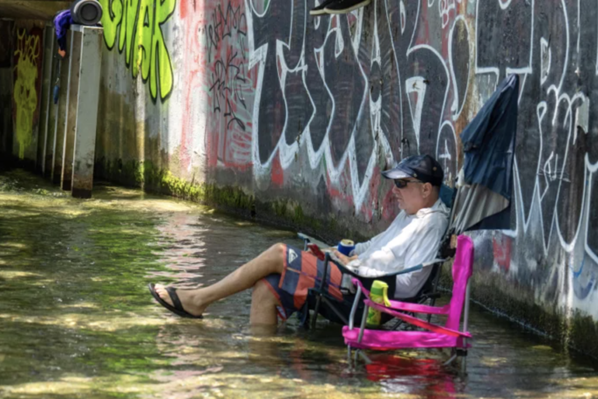 Residents cool off at Barton Creek in Austin, Tex., during a June heat wave. Parts of Texas have seen weeks of punishing heat and humidity | Suzanne Cordeiro/AFP via Getty Images