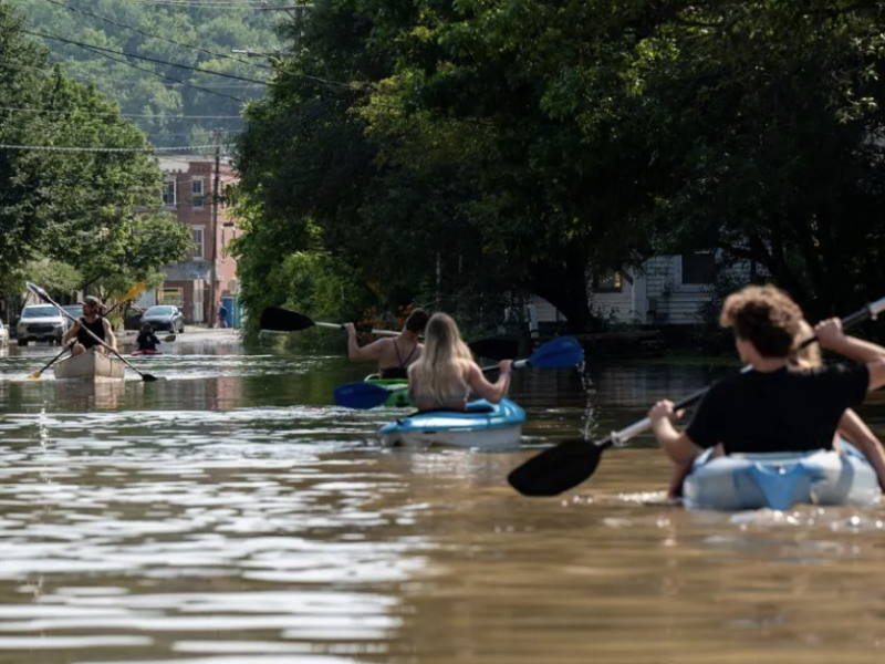 People kayak up and down the flooded waters of Elm Street on July 11, 2023 in Montpelier, Vermont. Eight inches of rain fell over 48 hours | Kylie Cooper