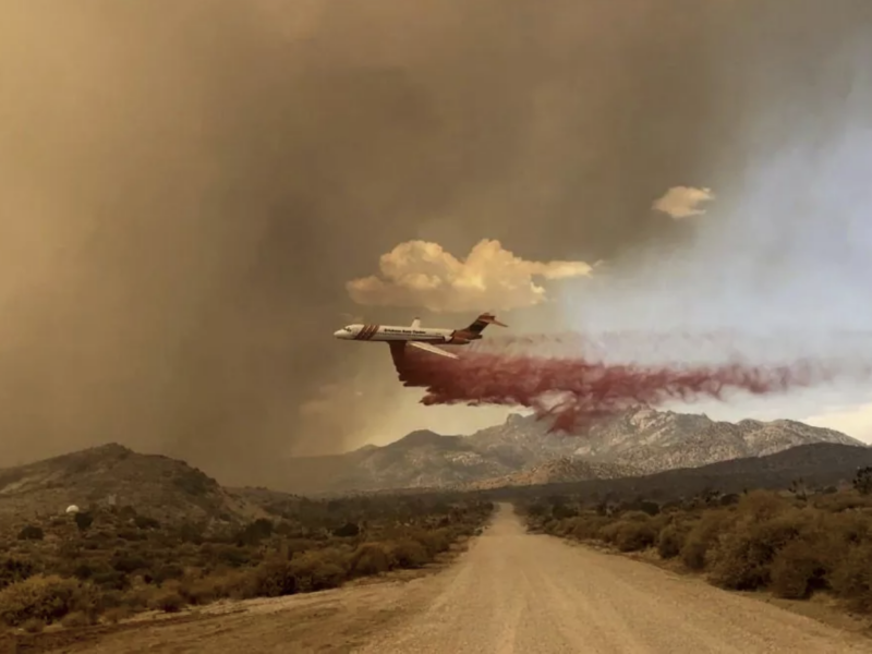 An air tanker drops fire retardant over the York fire in the Mojave National Preserve on Saturday. | R. Almendinger, National Park Service