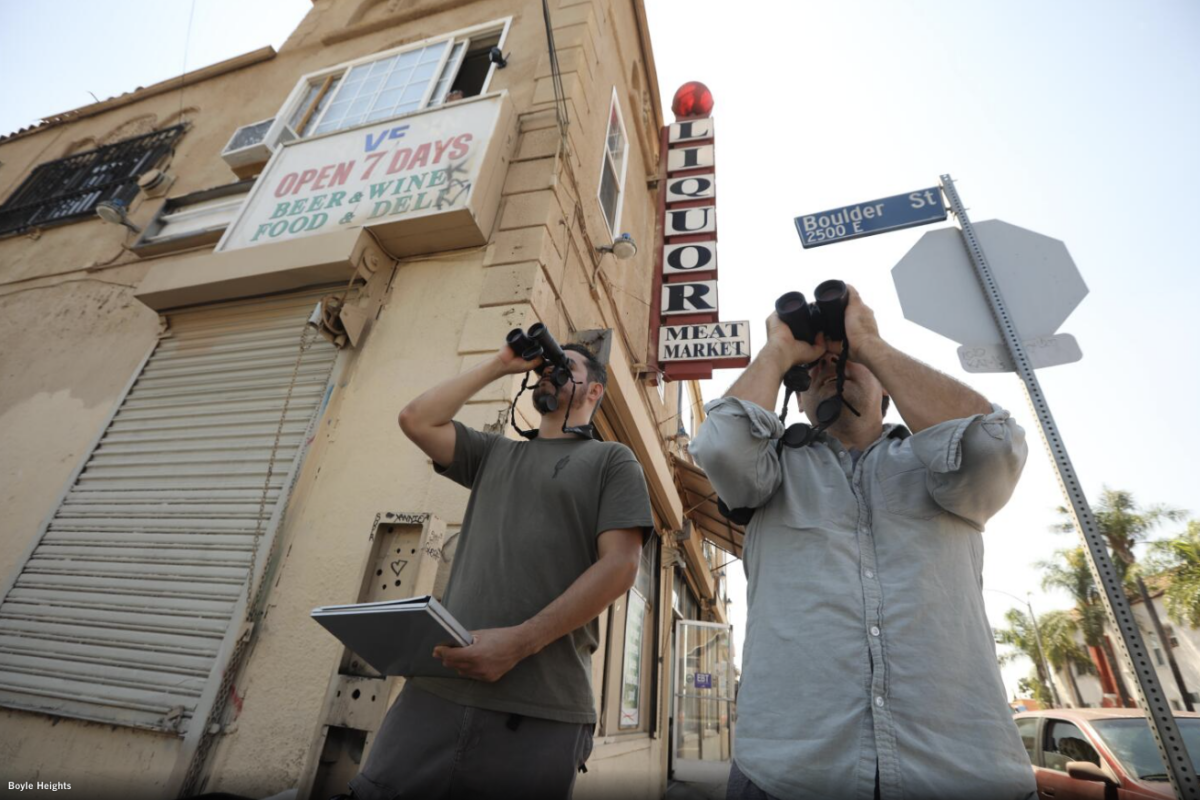 Christian Benitez and Eric M Wood stood outside a corner liquor store searching for birds. Genaro Melina, LA Times