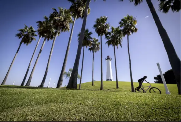 A young person rides their bike at Shoreline Aquatic Park in Long Beach. (Allen J. Schaben / Los Angeles Times)