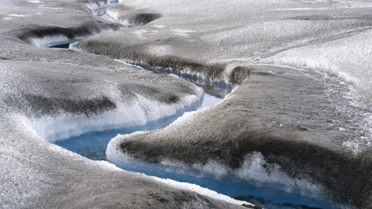 Brown sediment marks rapidly melting ice on the Greenland ice sheet.Credit: Martin Zwick/Reda&Co/Universal Images Group via Getty