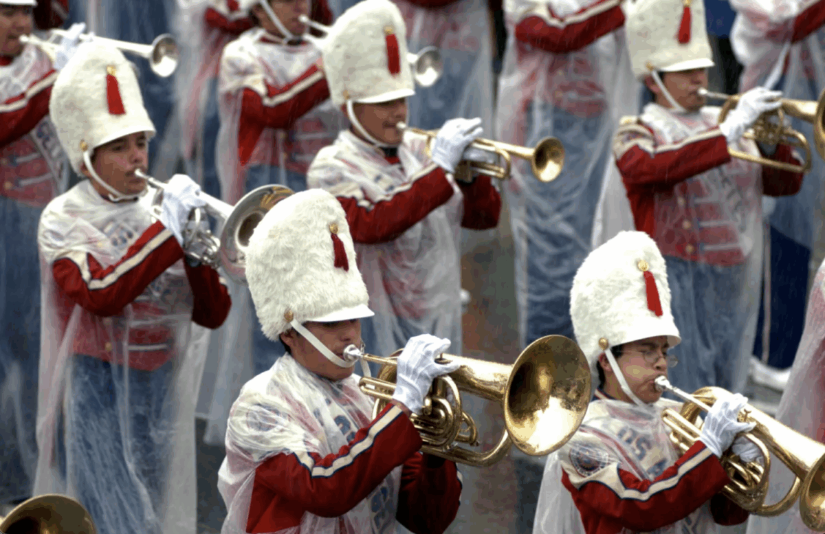 Los Angeles Unified School District Honor Band is wrapped in plastic during the 117th Annual Rose Parade on Monday, Jan. 2, 2006, in Pasadena, Calif. It rained on the Rose Parade for the first time in more than a half century. (Photo by Leo Jarzomb, Pasadena Star-News/SCNG)