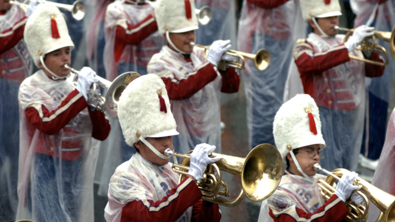 Los Angeles Unified School District Honor Band is wrapped in plastic during the 117th Annual Rose Parade on Monday, Jan. 2, 2006, in Pasadena, Calif. It rained on the Rose Parade for the first time in more than a half century. (Photo by Leo Jarzomb, Pasadena Star-News/SCNG)