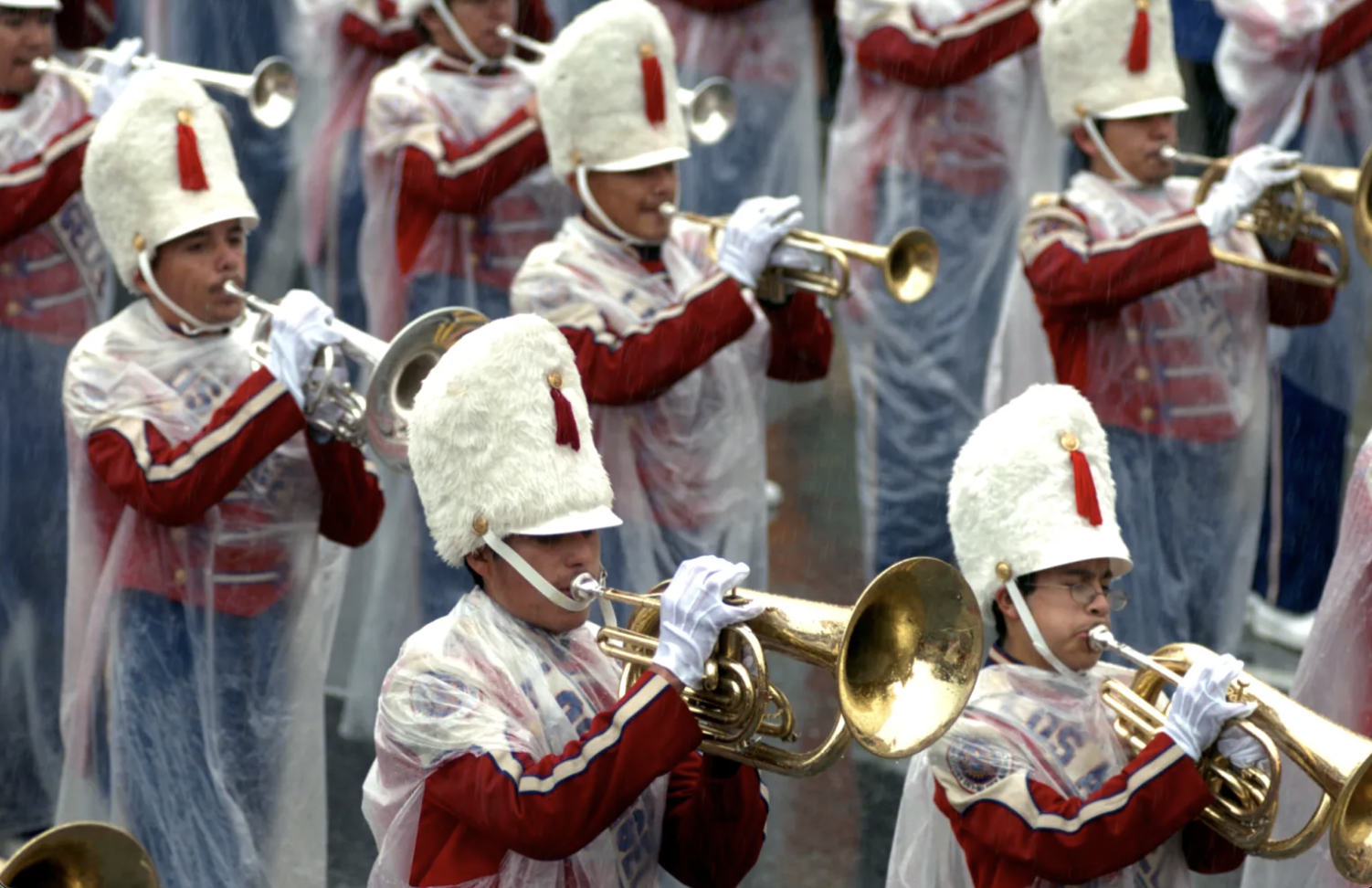 Los Angeles Unified School District Honor Band is wrapped in plastic during the 117th Annual Rose Parade on Monday, Jan. 2, 2006, in Pasadena, Calif. It rained on the Rose Parade for the first time in more than a half century. (Photo by Leo Jarzomb, Pasadena Star-News/SCNG)