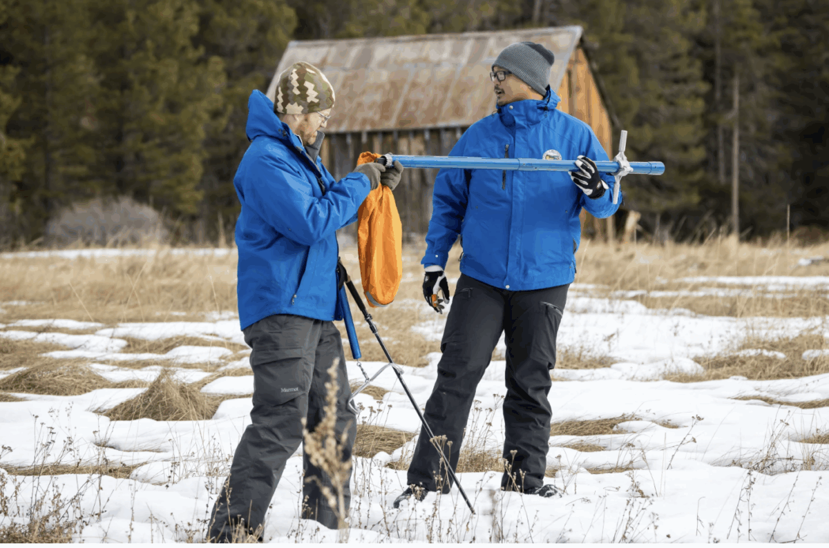 Right, Sean de Guzman and Anthony Burdock with the CA Department of Water Resources, measure snowpack during the first media snow survey of the 2024 season at Phillips Station in the Sierra Nevada. ( Xavier Mascareñas / California Department of Water Resources )