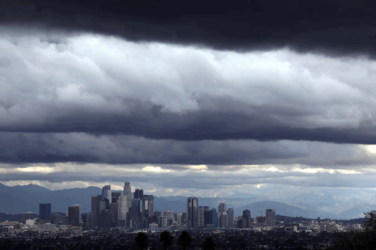 Despite a recent spate of storms that hit California, the Sierra Nevada is suffering a severe, early season ‘snow drought,’ experts say. Here, storm clouds dwarf downtown Los Angeles on Dec. 21, 2023. Credit Genaro Molina. Los Angeles Times