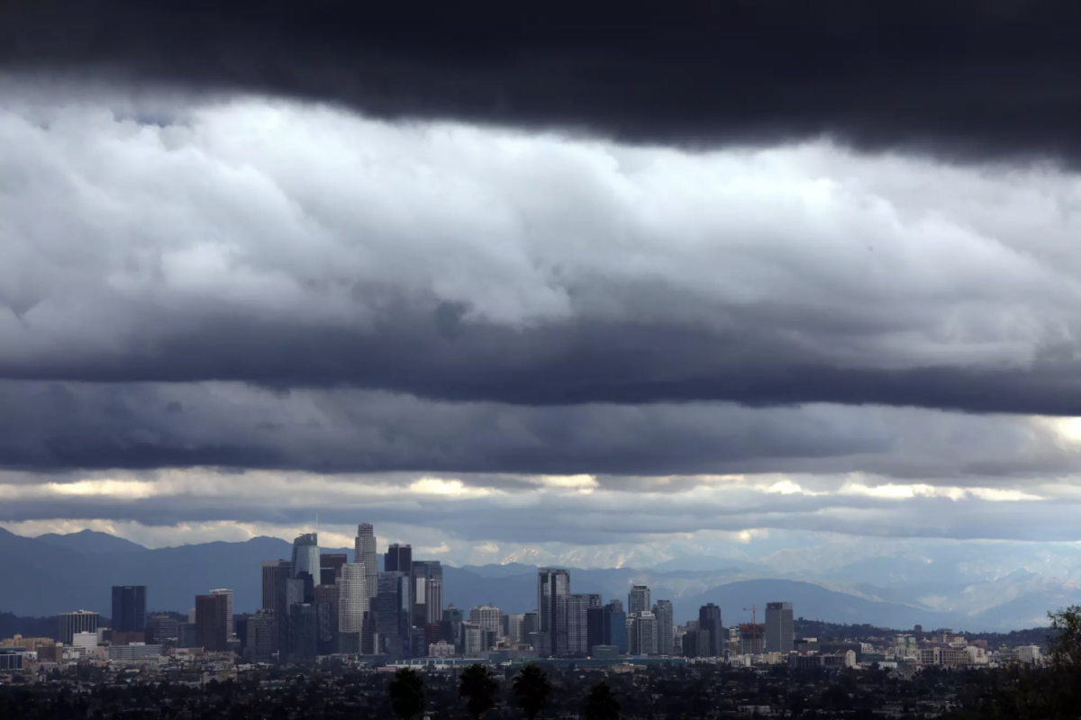 Despite a recent spate of storms that hit California, the Sierra Nevada is suffering a severe, early season ‘snow drought,’ experts say. Here, storm clouds dwarf downtown Los Angeles on Dec. 21, 2023. Credit Genaro Molina. Los Angeles Times
