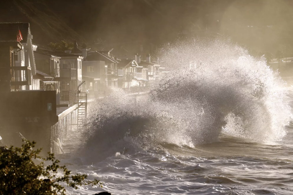 Waves crash into a seawall at Mondo’s Beach in Ventura County in January 2016 during an El Niño storm. (LA Times)