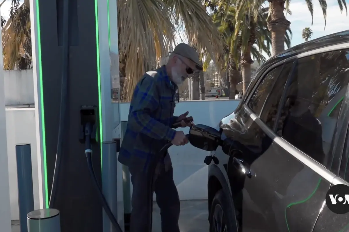 Driver charging Electric Vehicle
