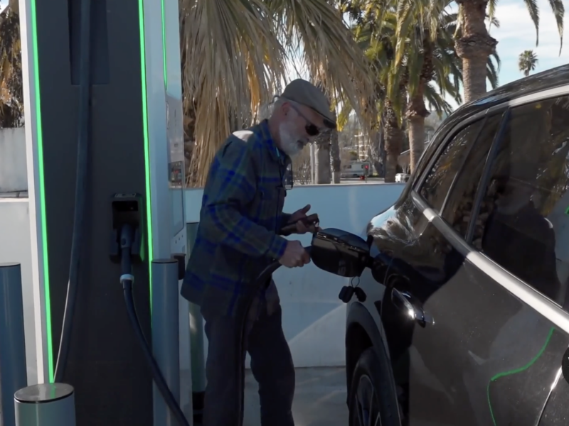 Driver charging Electric Vehicle