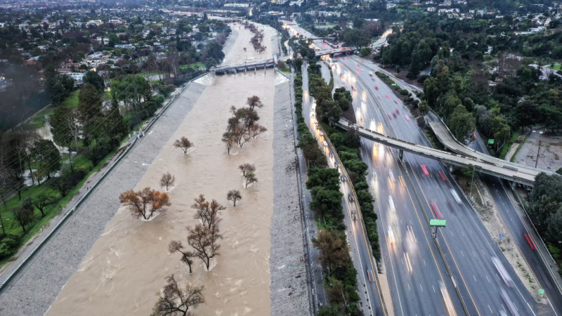 The Los Angeles River is swollen by storm runoff during an atmospheric river storm on Monday. Photograph: Mario Tama/Getty Images