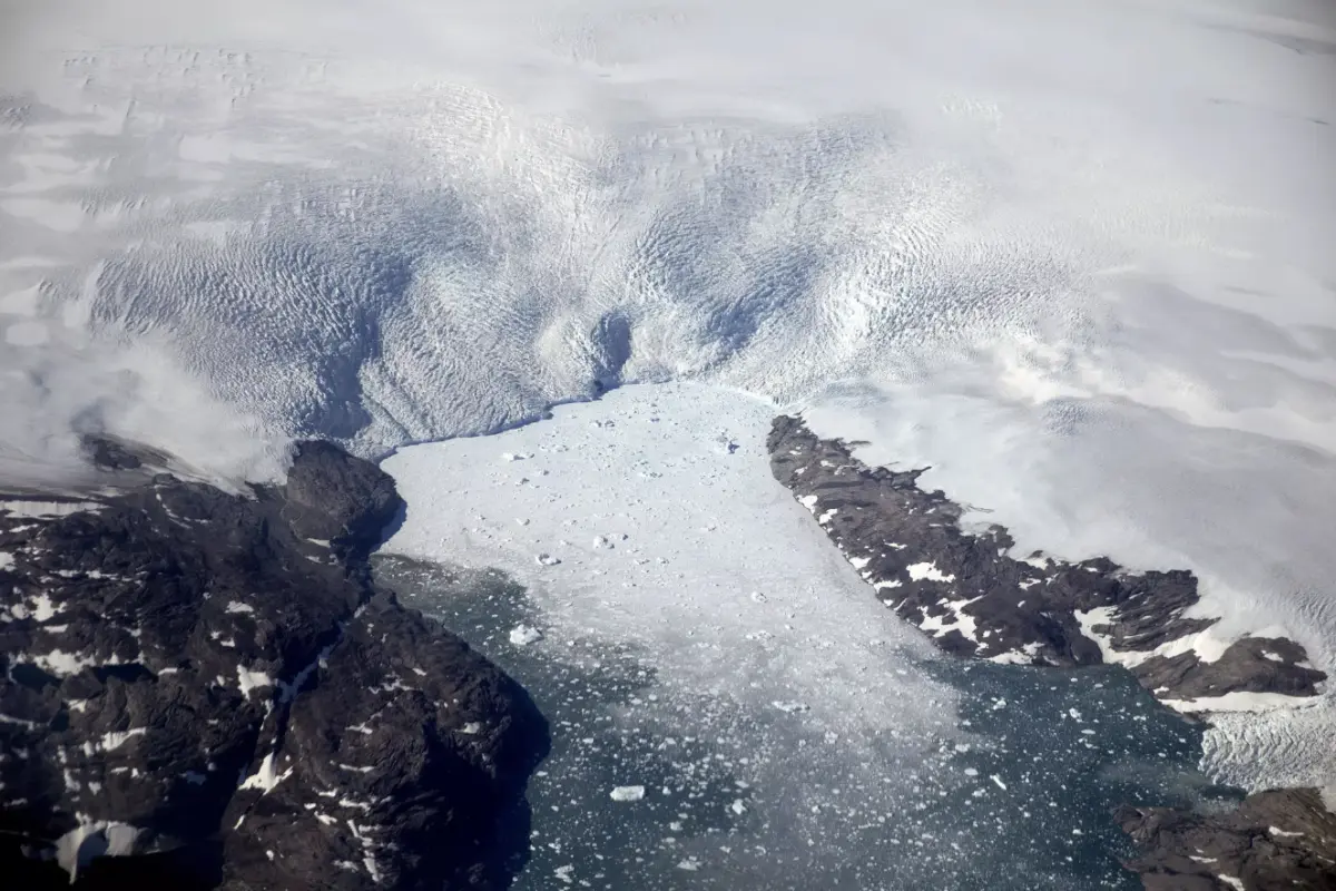 Chunks of ice break off from the Greenland ice sheet in 2017, creating a swarm of icebergs in a fjord.(David Goldman / Associated Press)