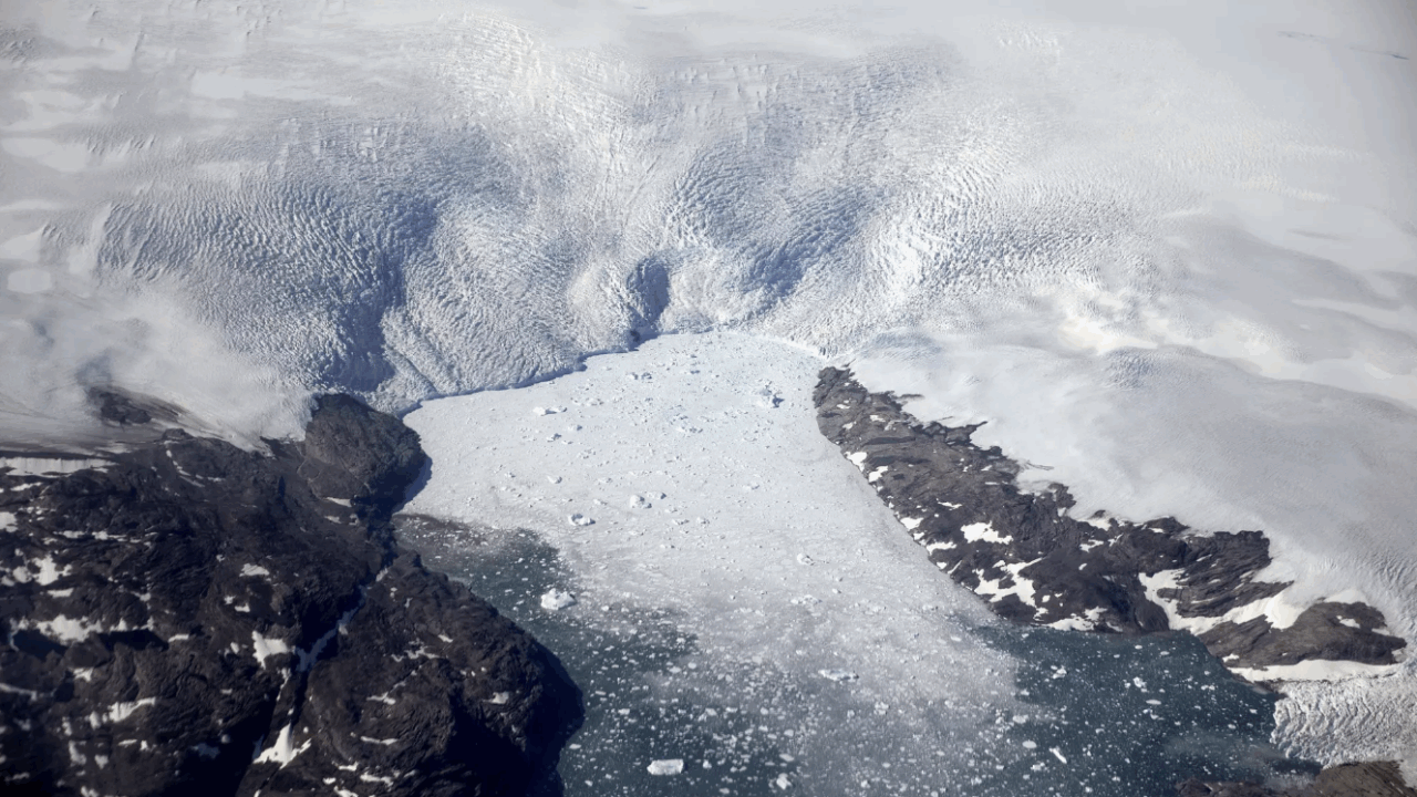 Chunks of ice break off from the Greenland ice sheet in 2017, creating a swarm of icebergs in a fjord.(David Goldman / Associated Press)