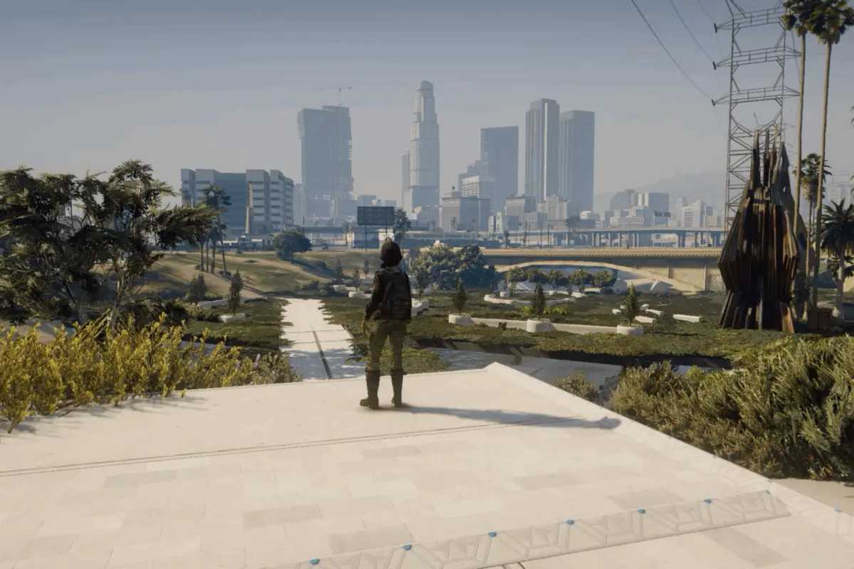 A video game scene in which a lone figure looks out over a restored, vegetated Los Angeles River channel toward the downtown skyline.