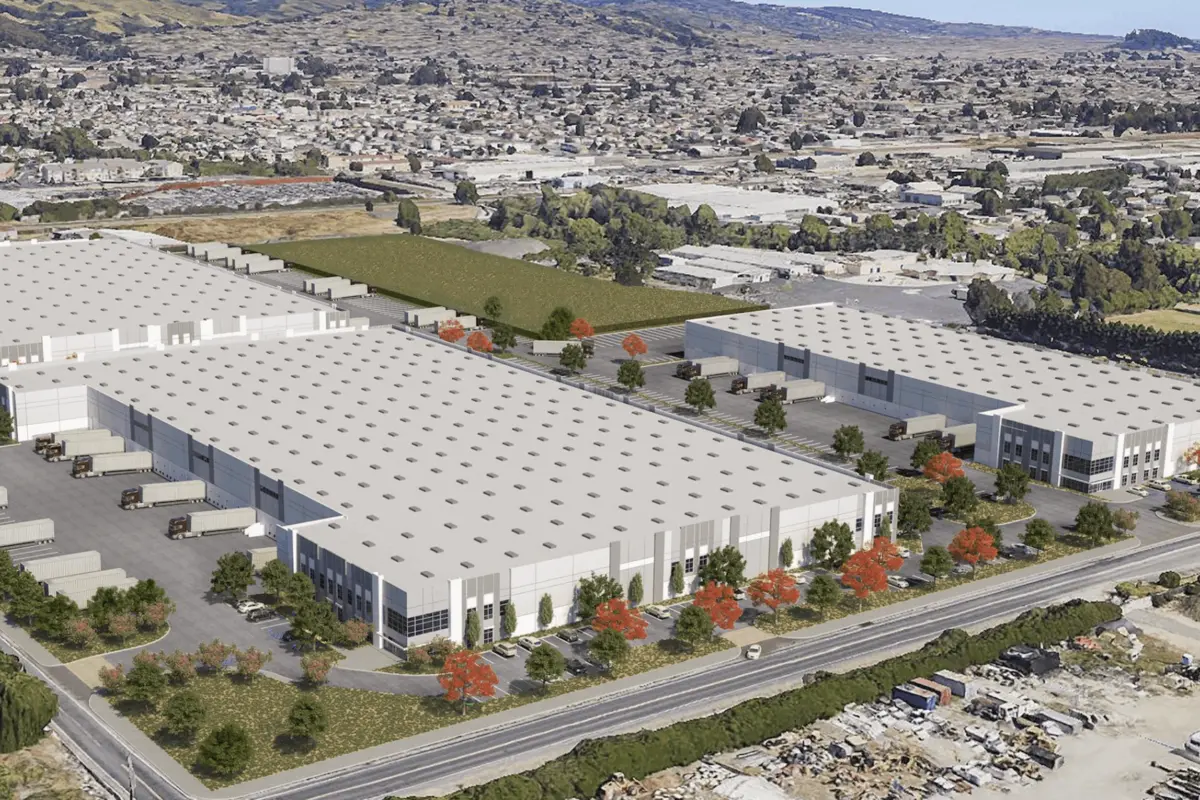 Aerial rendering of a large warehouse and logistics complex with loading docks and truck lots bordering a residential neighborhood.