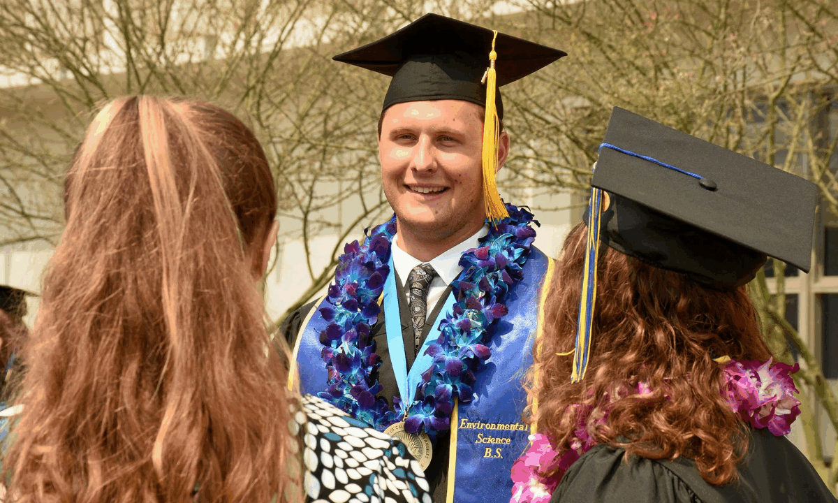 UCLA IoES graduate smiles after commencement ceremony