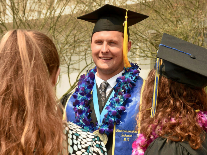 UCLA IoES graduate smiles after commencement ceremony