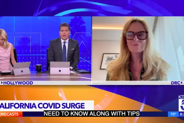 KTLA news anchors interview Dr. Anne Rimoin by video link under a chyron reading "California Covid surge."