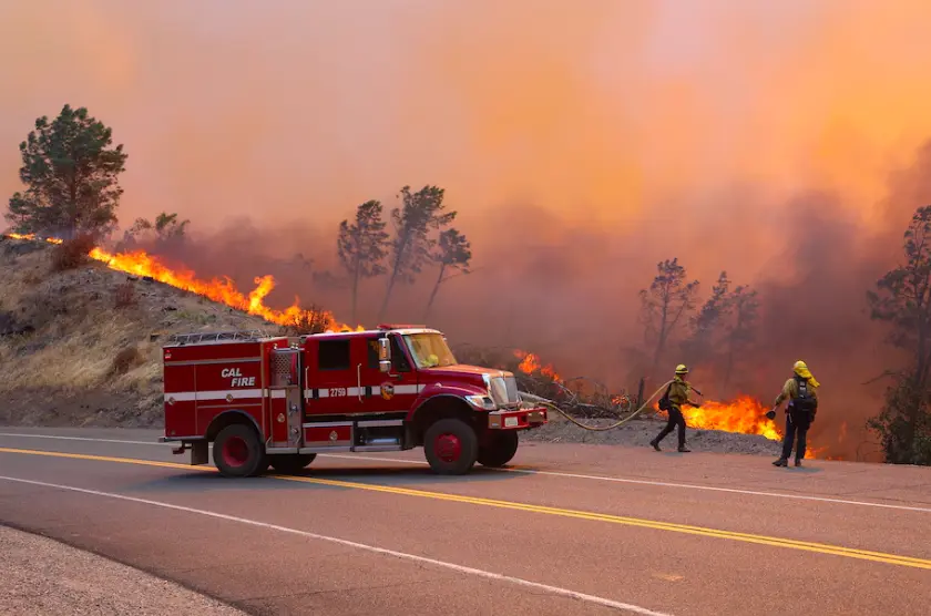 Firefighters work to control the Park Fire on Wednesday. (Cal Fire Amador-El Dorado Unit/via REUTERS)