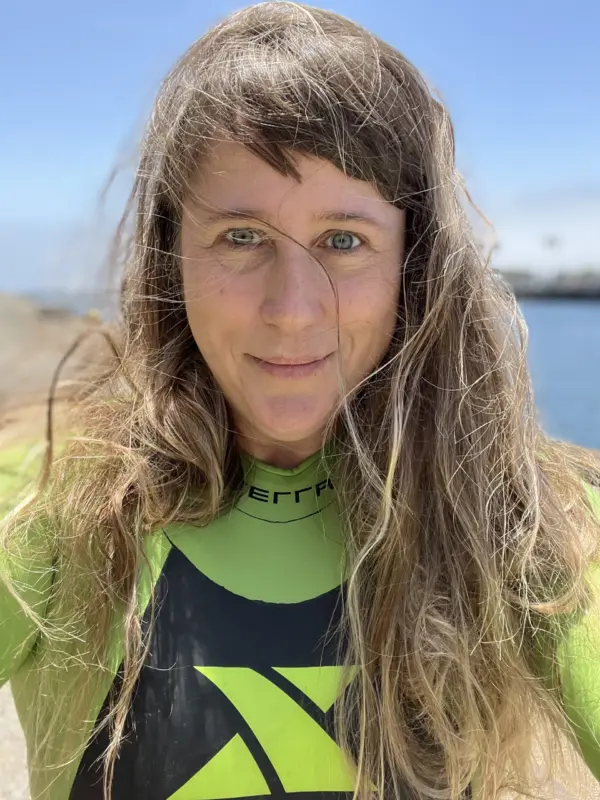 Siobhan Braybrook in a wetsuit at the coast