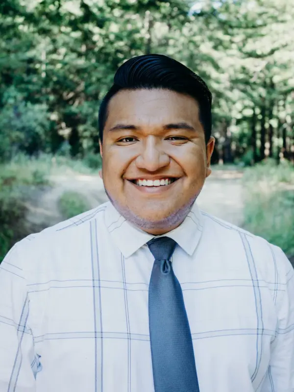 Michael Rincon, outdoors on a wooded trail