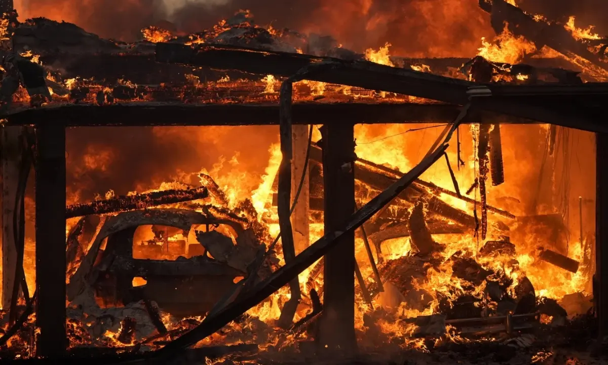 A home burns in the Mountain Fire, Nov. 6 2024, in Camarillo, Calif.