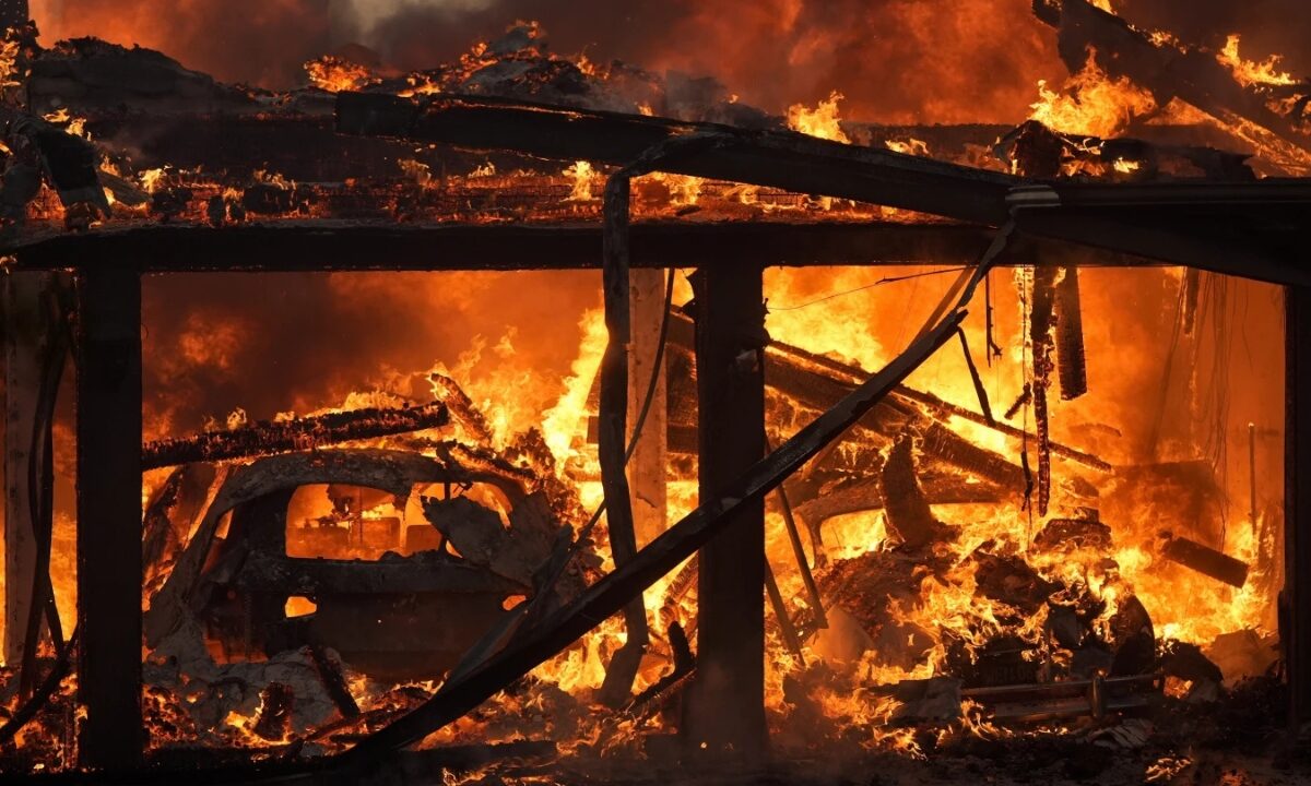 A home burns in the Mountain Fire, Nov. 6 2024, in Camarillo, Calif.