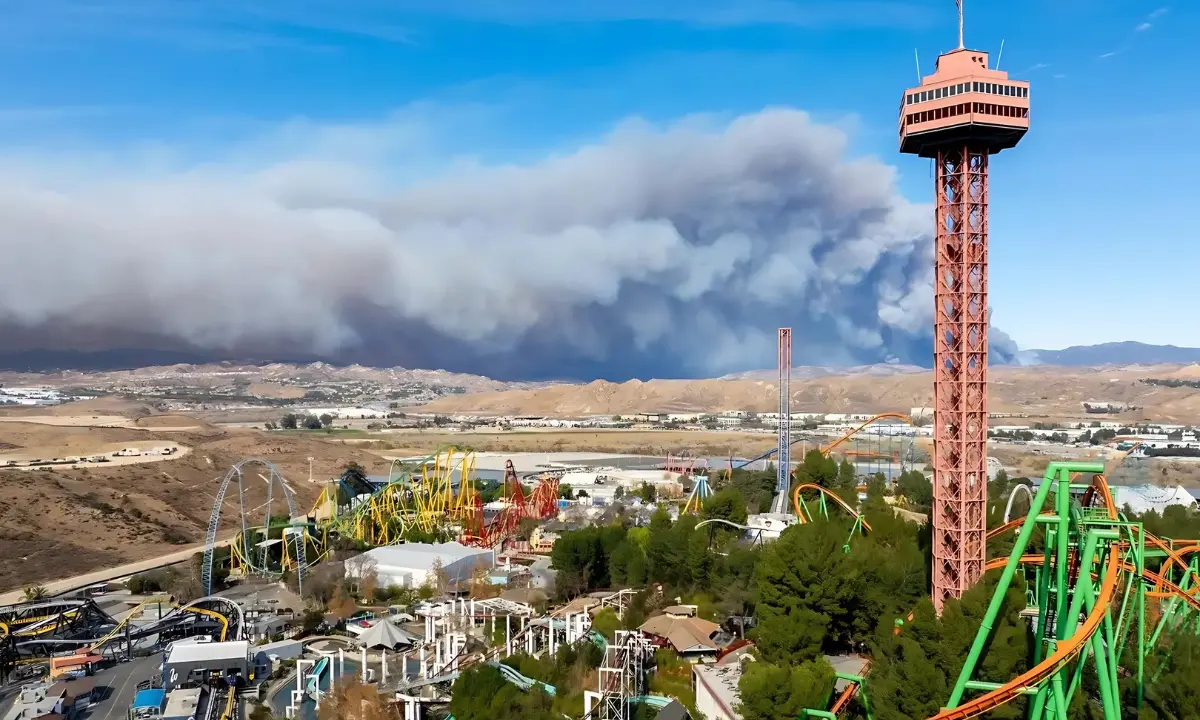 The Hughes Fire burns behind the skyline of Six Flags Magic Mountain, in Valencia, Calif., on Thursday.Brandon Bell / Getty Images