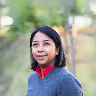 Tiana Andriamanana, photographed outdoors amid greenery.