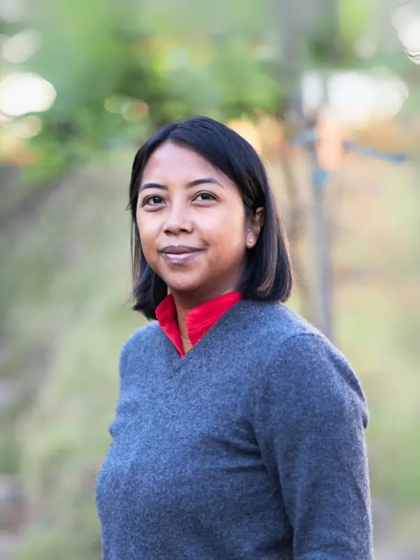 Tiana Andriamanana, photographed outdoors amid greenery.