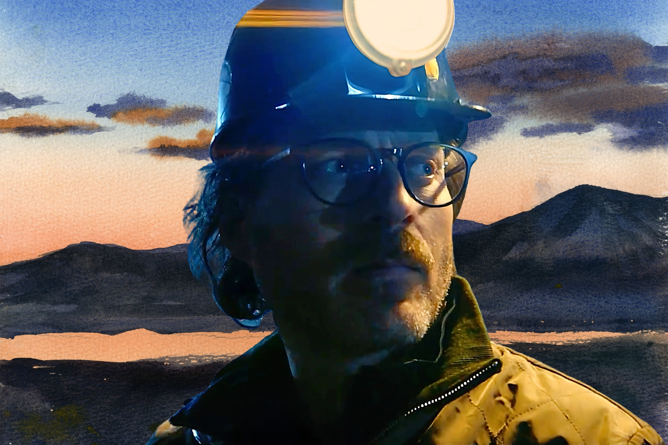 Jonathan Webb, a 2025 Pritzker nominee and Co-founder of The Nuclear Company, wears a hard hat and glasses while looking into the distance. A soft watercolor-style mountain landscape appears behind him.
