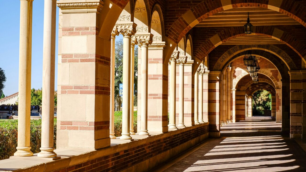 Outside Royce Hall long hallway with columns and arches