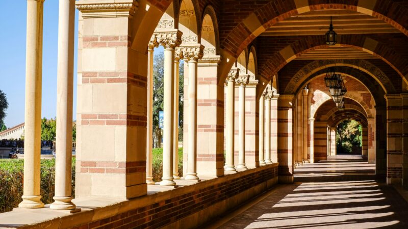 Outside Royce Hall long hallway with columns and arches