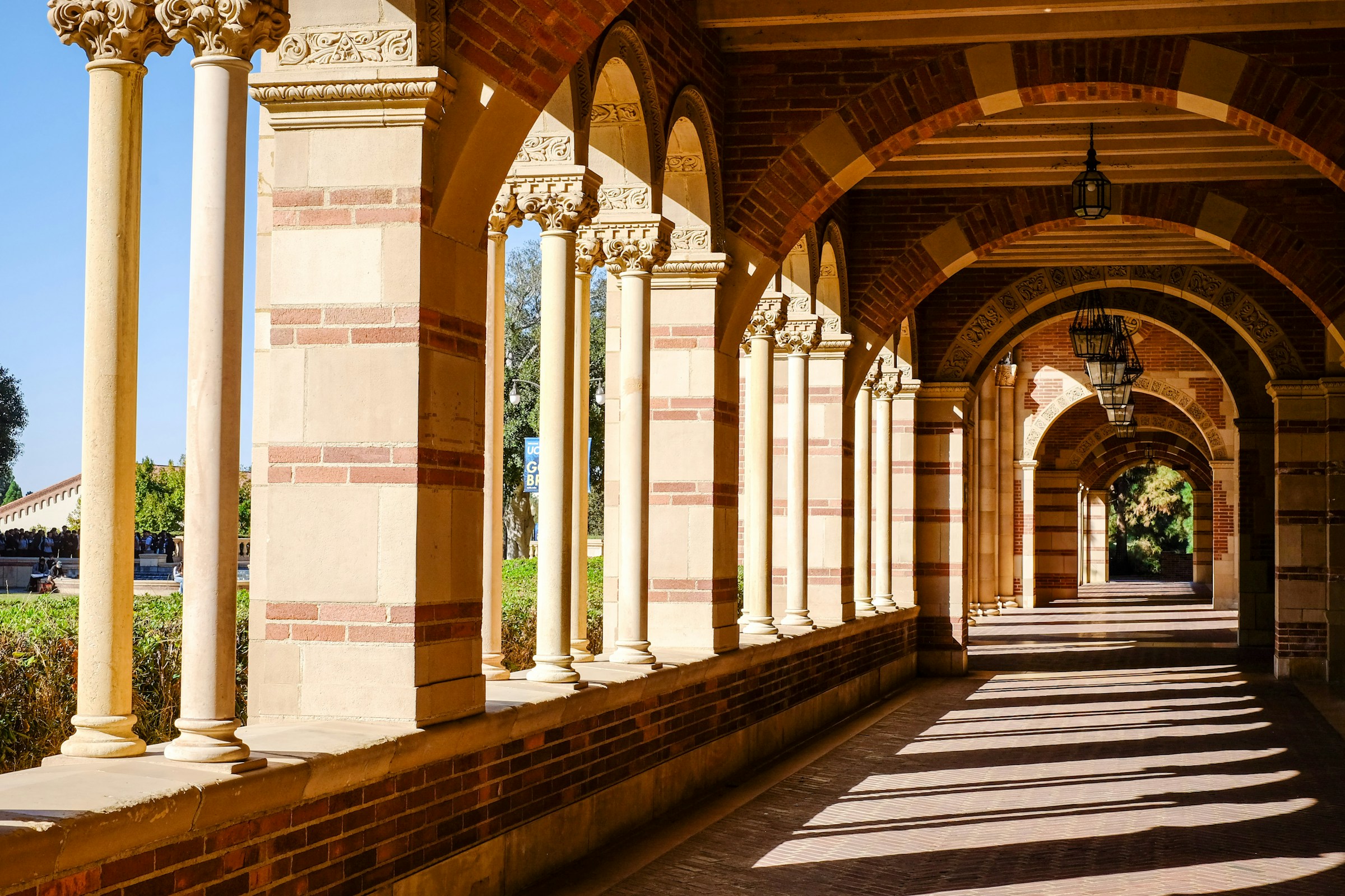 Outside Royce Hall long hallway with columns and arches