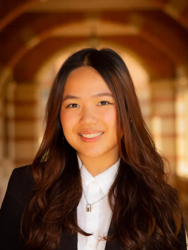 Allie Quan, photographed in an arched campus walkway
