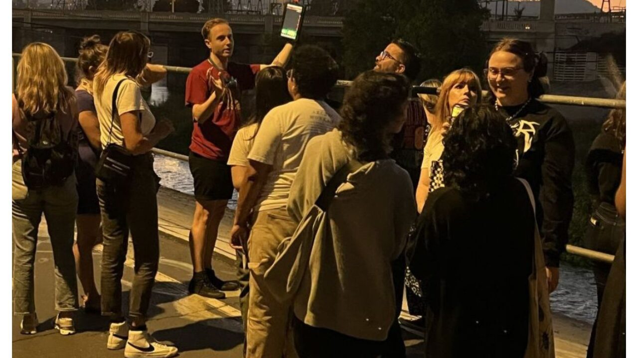 UCLA postdoc Joseph Curti leading public on evening bat walk.