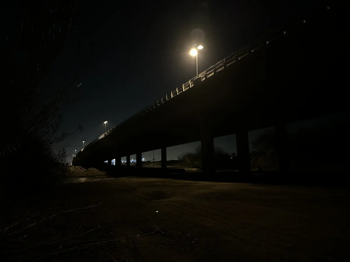 Street light over urban bridge at night