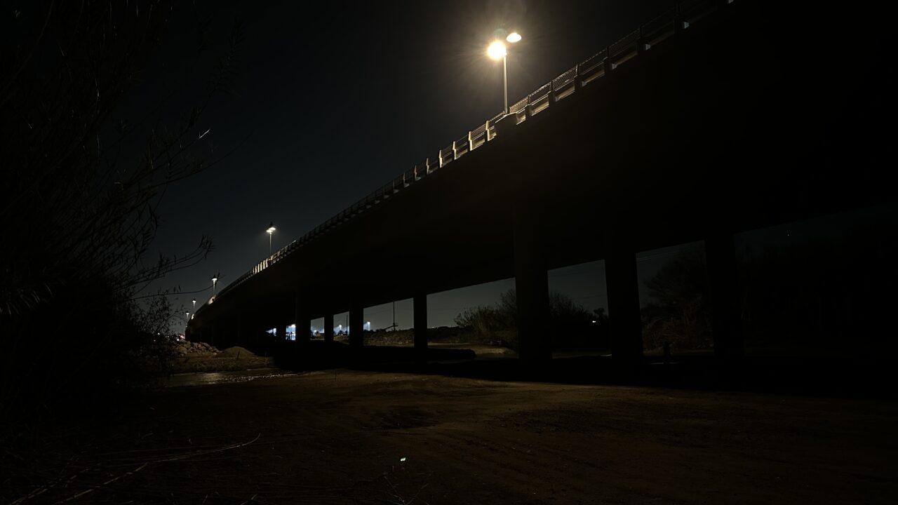 Street light over urban bridge at night