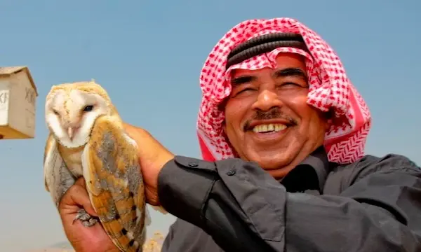 Man Holding Barn Owl