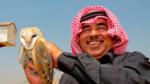 Man Holding Barn Owl