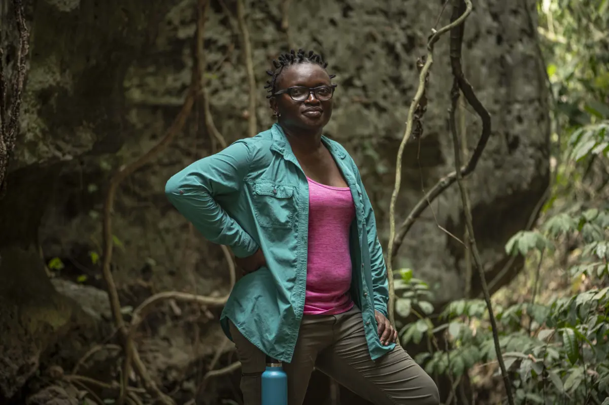Iroro Tanshi, 39 stands for a portrait near a limestone cave in Etankpini village in Odukpani